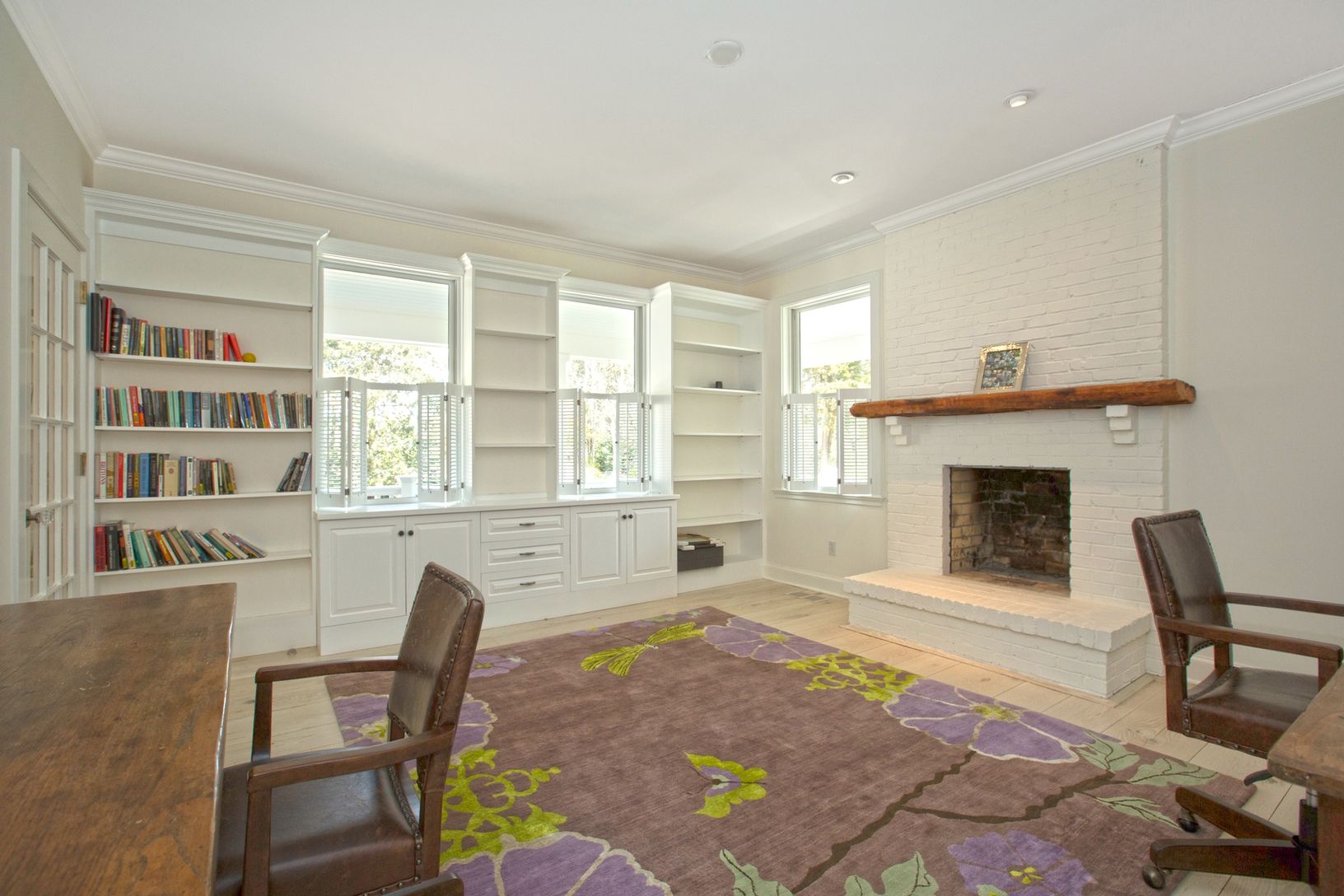  Family room with fireplace being used as office