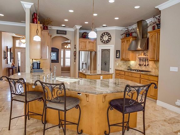 Granite and travertine highlight the spacious kitchen.  Expansive counters offer plenty of prep space...