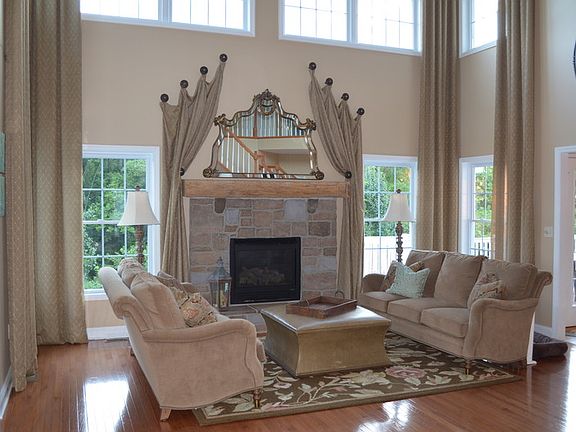 Great Room
						:
						Double glass doors to screened porch. Gas fireplace and 10 windows!