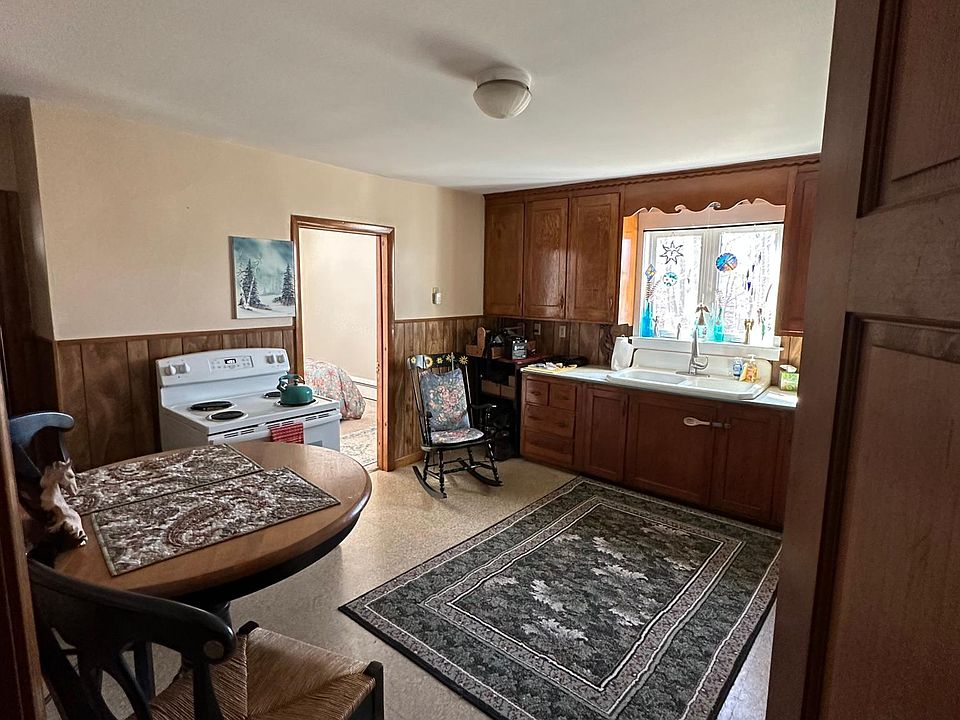 View of the kitchen while the current tenant is occupied. Furnishings not included. Washer & Dryer hookups in Kitchen.