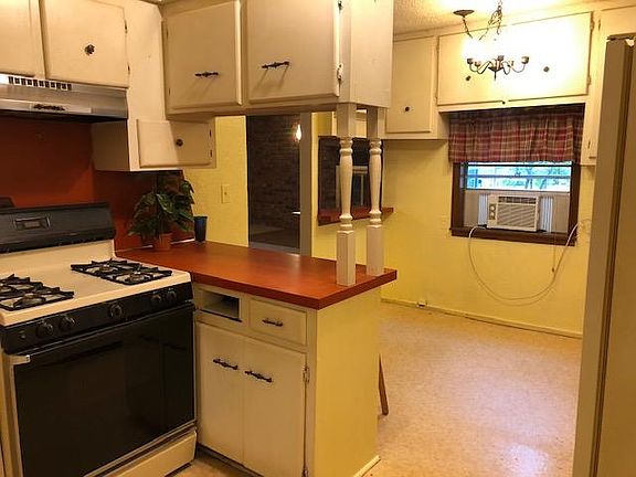 Kitchen view to breakfast nook/dining area.