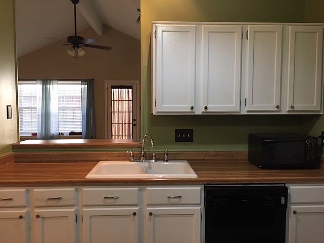 Bright kitchen with bar.