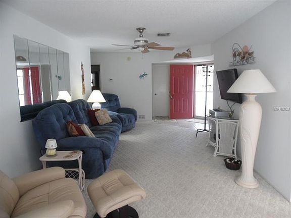 Front door opens to tiled entryway and the Living Room