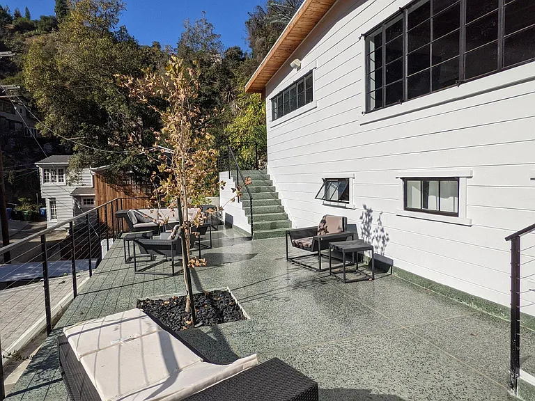 Views of Front Facade and rear entry staircase to Master Bedroom