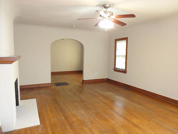 Large living/dining with hardwood floors and cathedral ceili