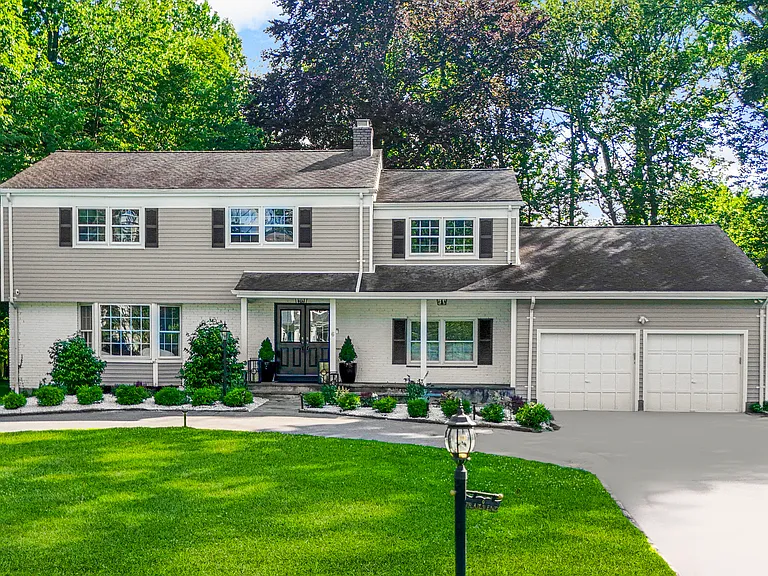 Sunny, updated Rye Colonial with partial water views in sought-after Greenhaven.