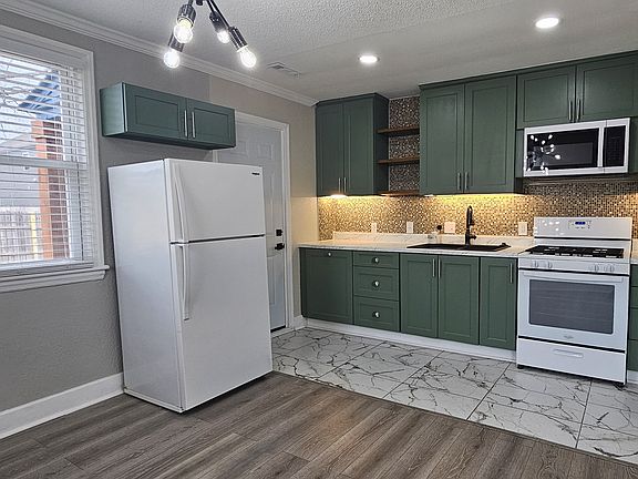 kitchen combines functionality, comfort, and elegant design. It features clean lines, high-quality materials, and a bright, open layout that creates a welcoming atmosphere.
