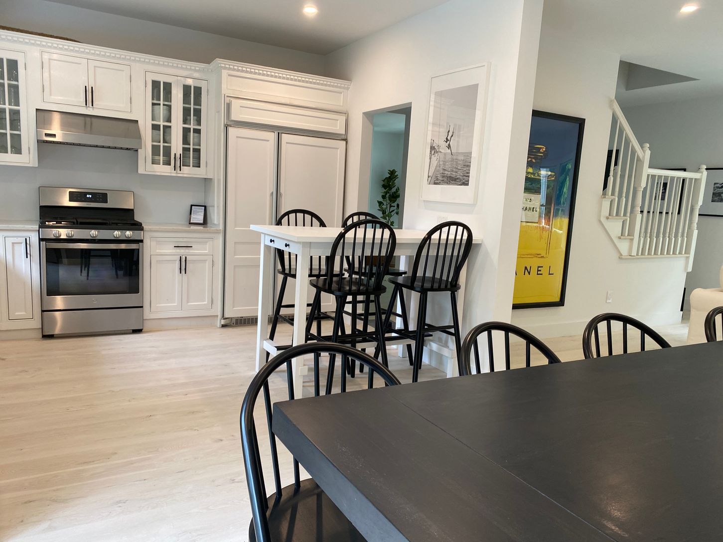  Open concept: kitchen, dining table, and living room /den