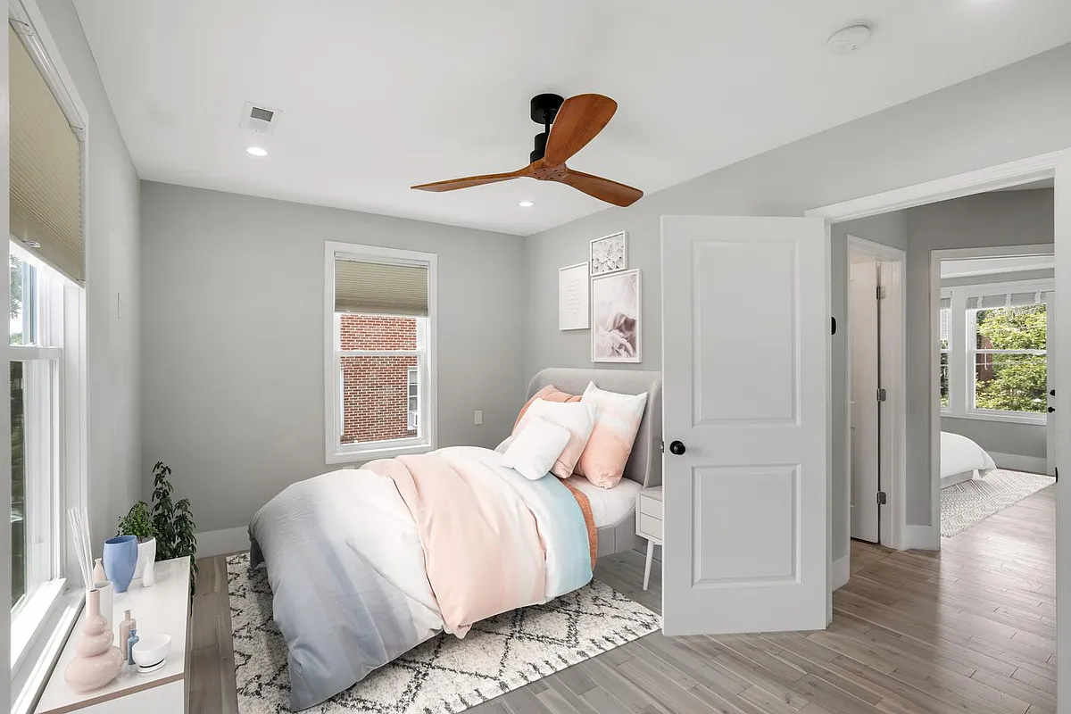 Bedroom 1. This image shows a virtually furnished space. Bedrooms come unfurnished. - 2235 Quincy St NE
