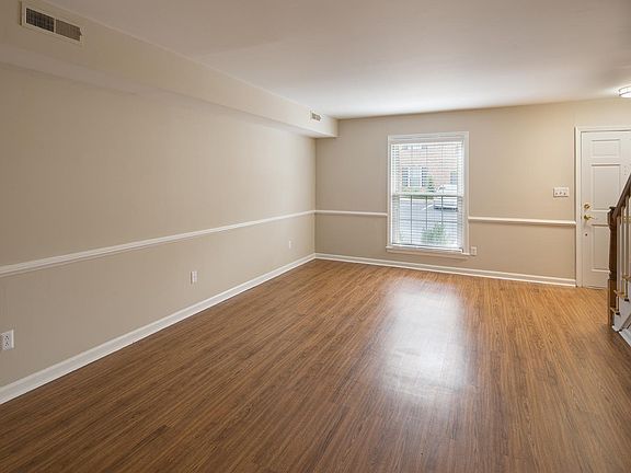 Large living room with huge storage closet under the stairs!