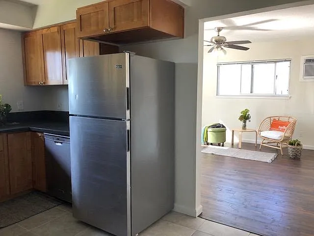Eat in kitchen has open concept to the living space and hall to the bathroom and both bedrooms.