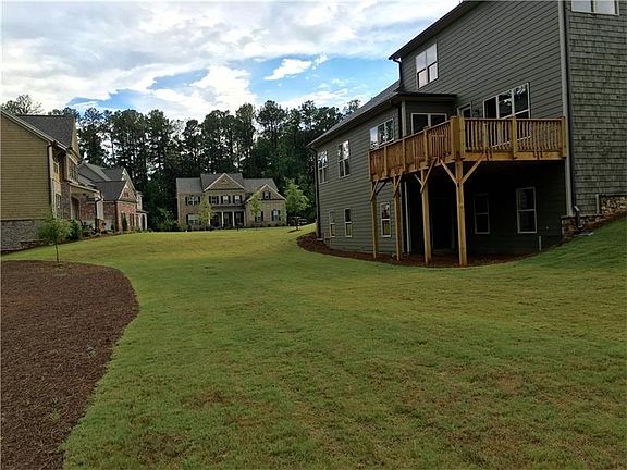 The sod goes back 20', but there is plenty more level yard that has pinestraw. This backyard is quit