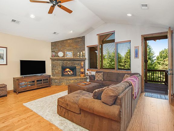 Living room with fireplace and patio