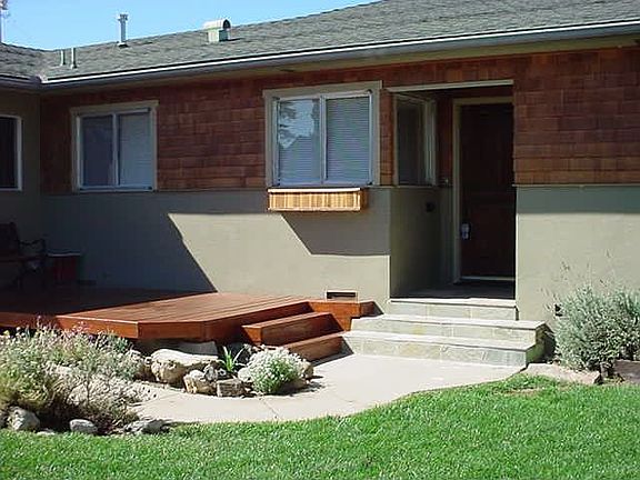 Landscaped front yard and deck.