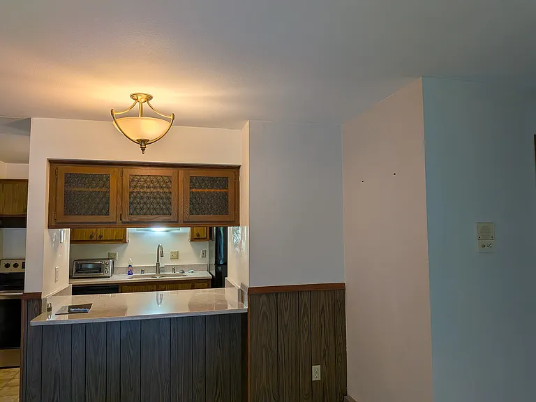 Another view of kitchen and dinning area