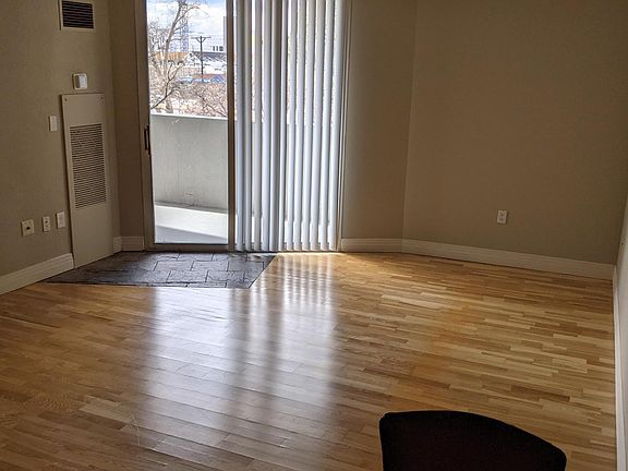 Living Room: Hardwoods and access to balcony