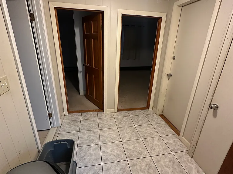 Hall to bathroom, bedroom #1, bedroom #2, and basement for laundry.