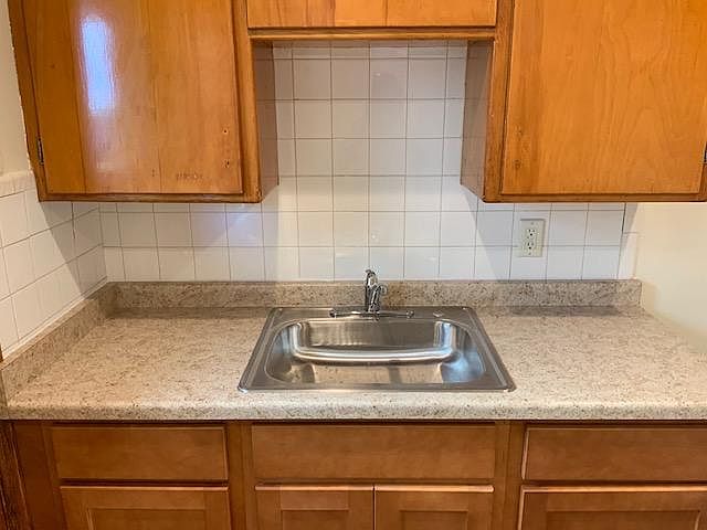 New kitchen counter, sink and cabinets