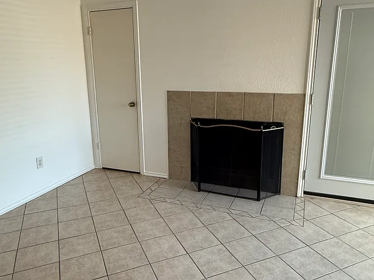 Electric fireplace and coat closet.