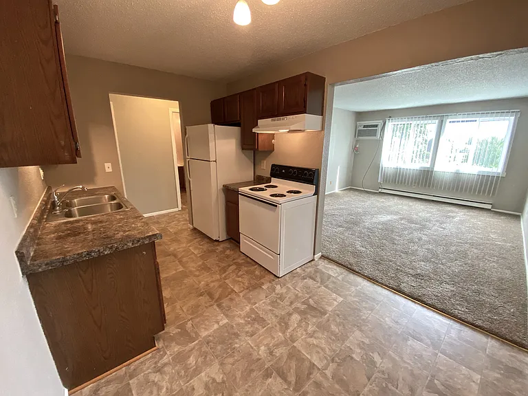 The galley kitchen blends seamlessly into a formal dining space!