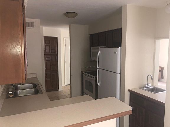 Kitchen with refrigerator/freezer, oven/stove, microwave