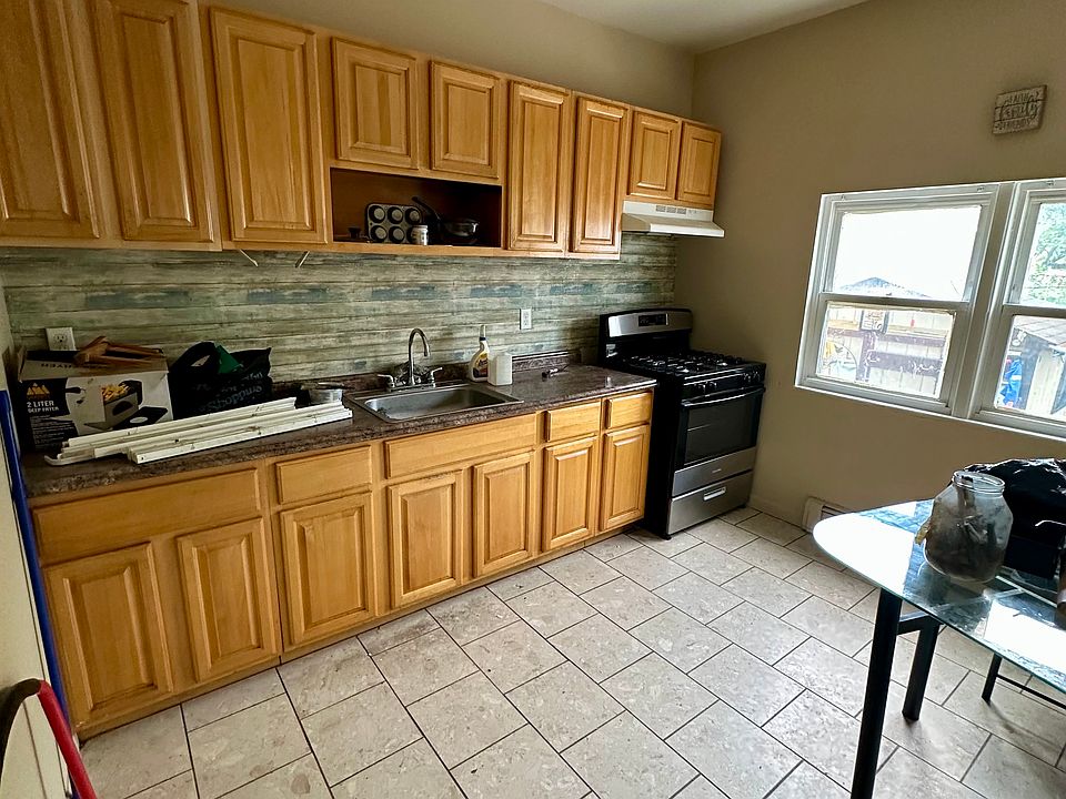 Expansive Modern Kitchen _ Designed for chefs and entertainers alike, with updated finishes, tile floor and abundant space & cabinets