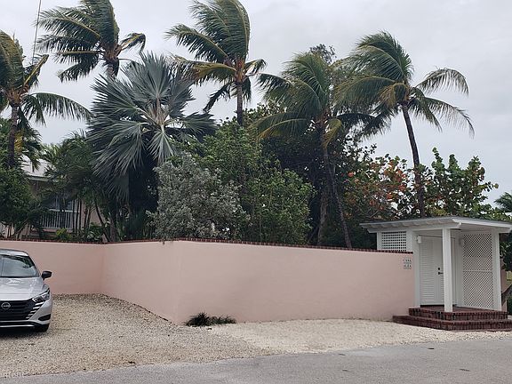 Off street parking, plus additional parking for guests across the street (Gulf side). Boat trailer must be parked in the off street fenced cutout area.