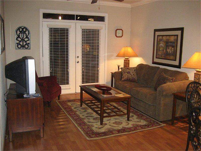 Open floor-plan is great for entertaining. Patio doors open to pool area.