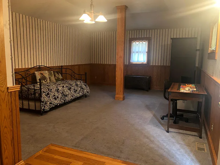 Living area. Facing north and east wall.