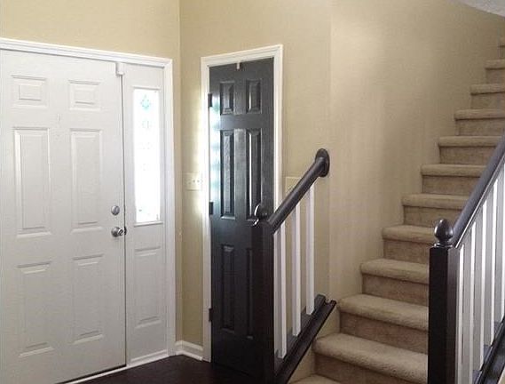 Beautiful 2 story entry with rich wood floor and new lighting.
