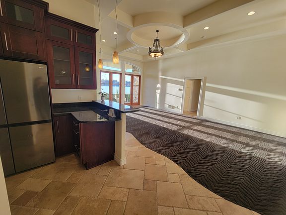 View from the Kitchen into the Great Room showing the architectural ceiling