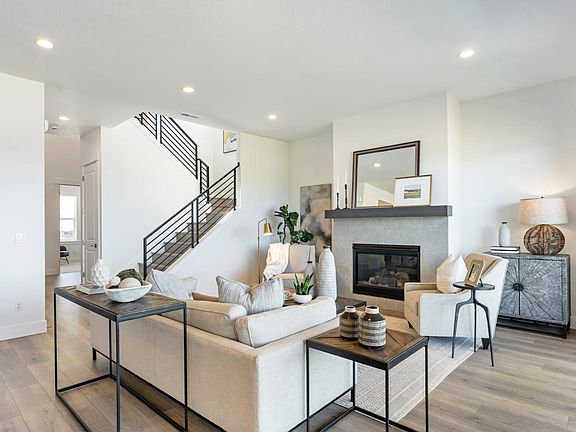 Open-concept great room features a cozy gas fireplace