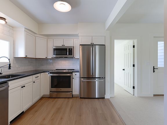 Kitchen with all new stainless steel appliances and hardwood floors