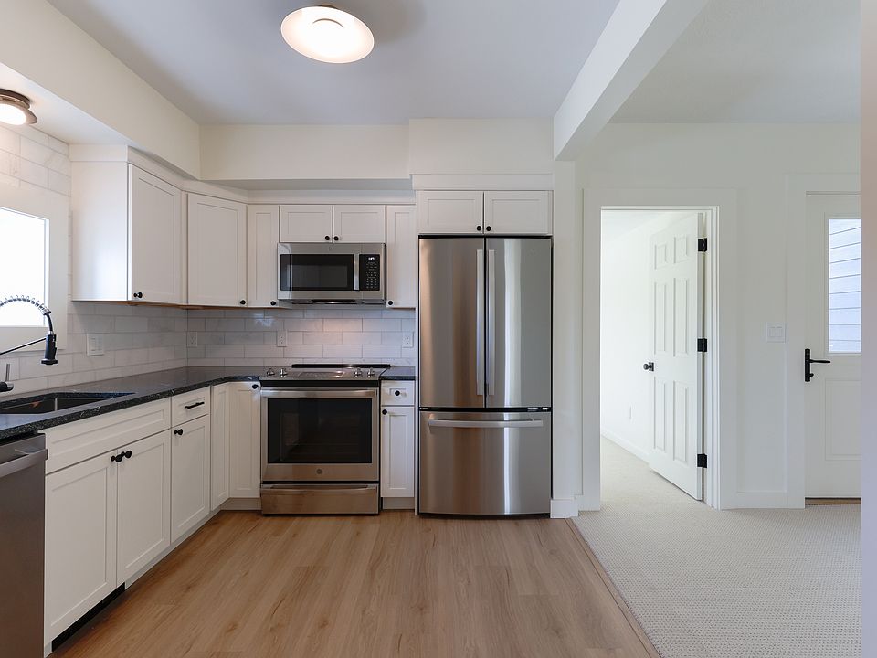 Kitchen with all new stainless steel appliances and hardwood floors
