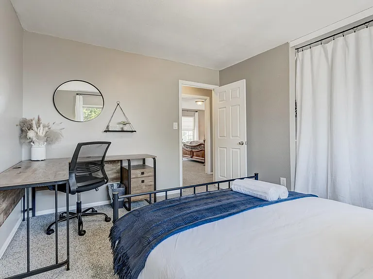 Upper Level Queen Bedroom

Queen sized bed with a desk to work if needed