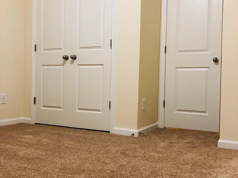 Bedroom 1, Closet and Door to Bathroom 1