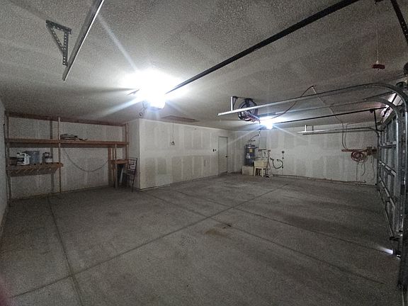 3 car garage with storage area.