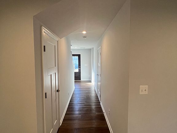 1st floor hallway, with hall closet and entrance to garage (on right)