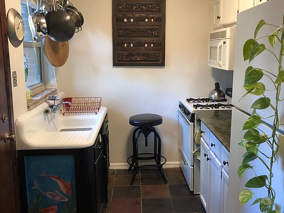 Kitchen. Original sink from 1940s painted with mural