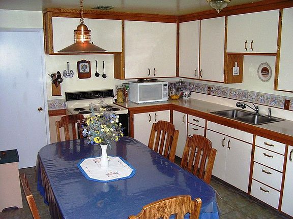 Spacious kitchen with ceramic tile flooring