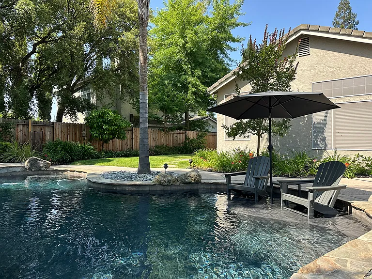 Pool with grassy area