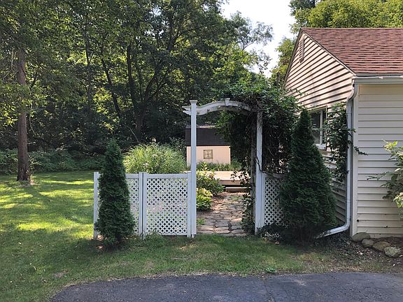 Side yard with flower and deck