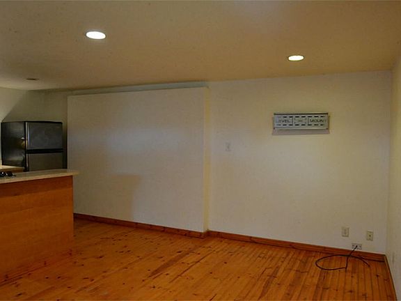 THE LVING ROOM HAS THE GARAGE DOOR SEALED OFF BUT CAN EASILY BE OPENED BACK UP.