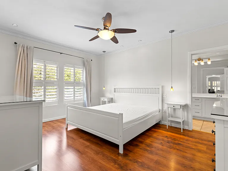 King size bed with dual night stands, large walk in closet, and 2 large dressers for additional storage