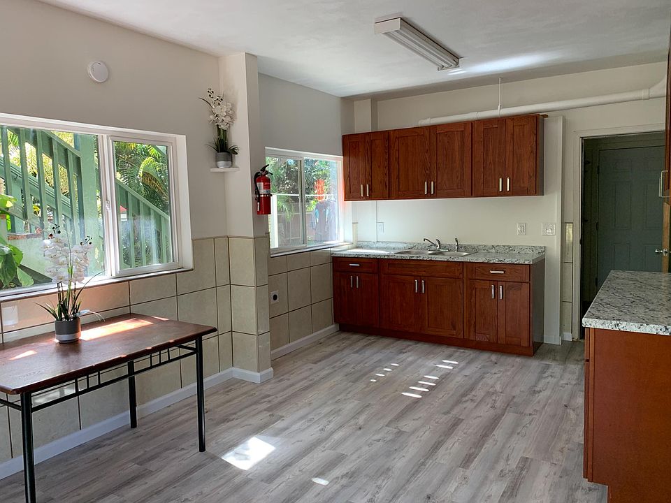 new floor, countertops, cabinets, sink, and faucet