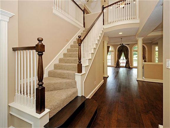 Two-story foyer invites one into the light & bright home with flowing floorplan..
