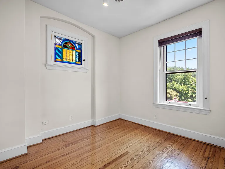 Bedroom #2 with stained glass window