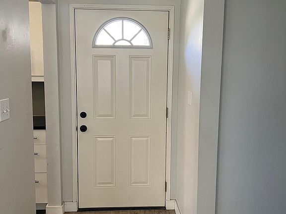 Front entry is light and bright, original hardwood flooring throughout