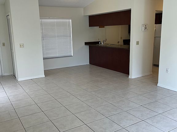 View from sliding doors back toward kitchen (front entry on left, dining nook)