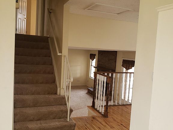 Doorway of Living Room going up to Bedrooms, Across to Dining Room & Kitchen or down to Family Room.